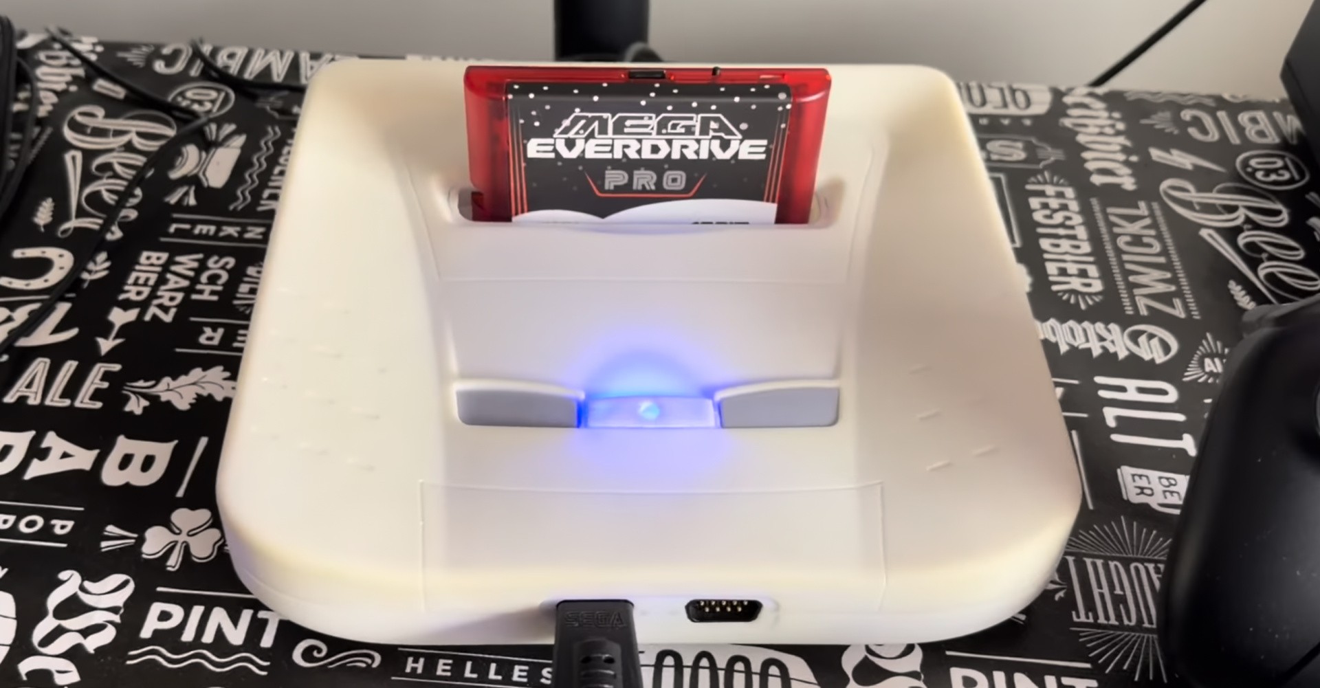 The GF1 Neptune FPGA console running a 32X game — a device Sega never shipped, reconstructed in programmable logic by GamesCare in Brazil