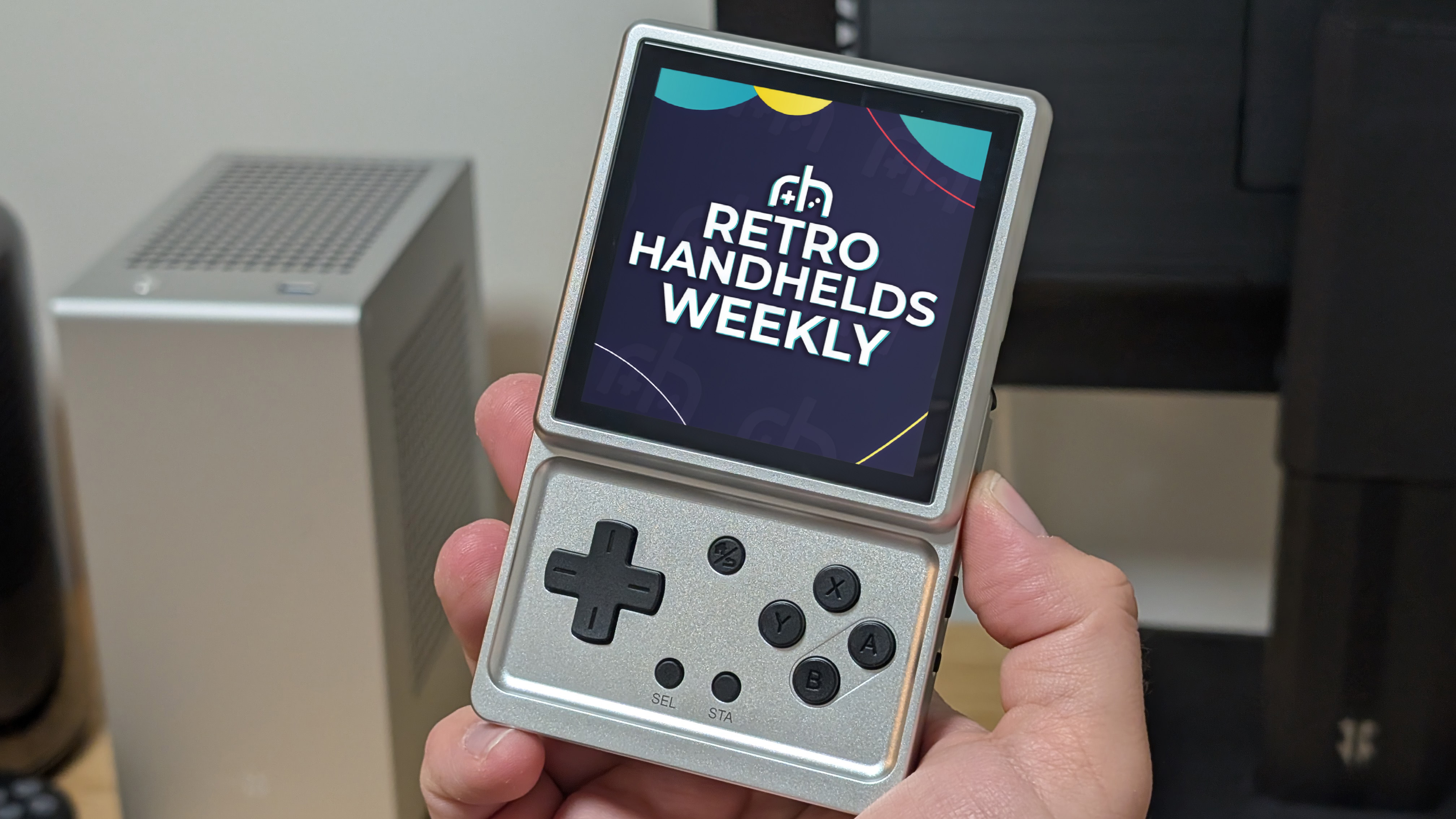 Two retro handhelds side by side, one running Batocera, the other running KNULLI — both displaying updated firmware splash screens